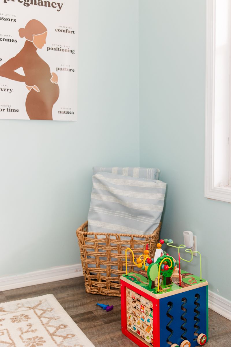 The pregnancy poster and toy corner in the adjusting room